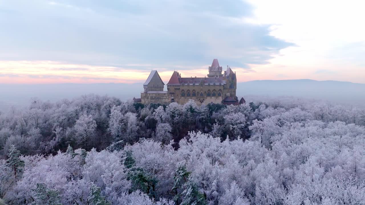 Burg Kreuzenstein Castle Surrounded By Winter Foliage At Sunset In Leobendorf Near Vienna In Austria. drone sideways shot