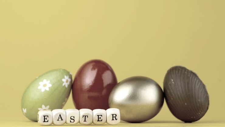 Dice spelling out easter falling in front of four easter eggs
