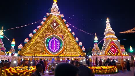 a hindu temple beautifully decorated with lights at night