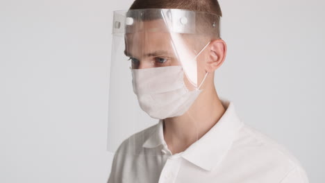 Young-guy-with-two-different-protective-masks