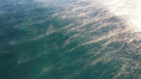 Sea-Fog-Rising-Over-Blue-Waters-In-Coolum-Beach-During-Sunrise-In-QLD,-Australia