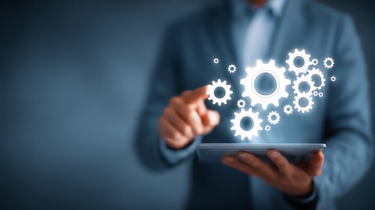 A professional analyzing data through a digital tablet, utilizing virtual gears to symbolize automation and process optimization in a modern work environment