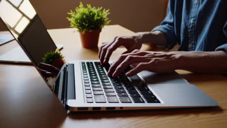 person typing on a laptop