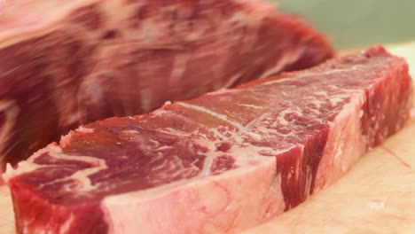 cutting striploin steak with the knife