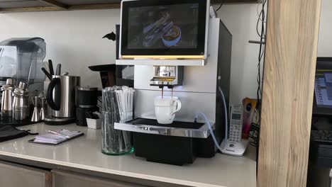 sequence showing a coffee machine brewing a cup