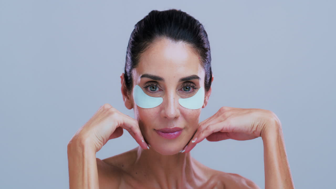 Woman Applying Under-Eye Patches for Skincare