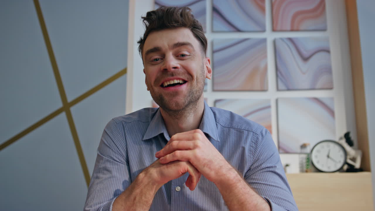 Friendly boss chatting online interview at modern interior closeup pov view