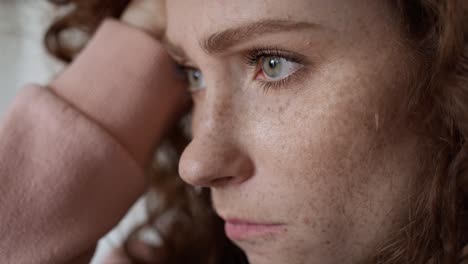 Extreme-close-up-of-thoughtful-young-caucasian-woman.