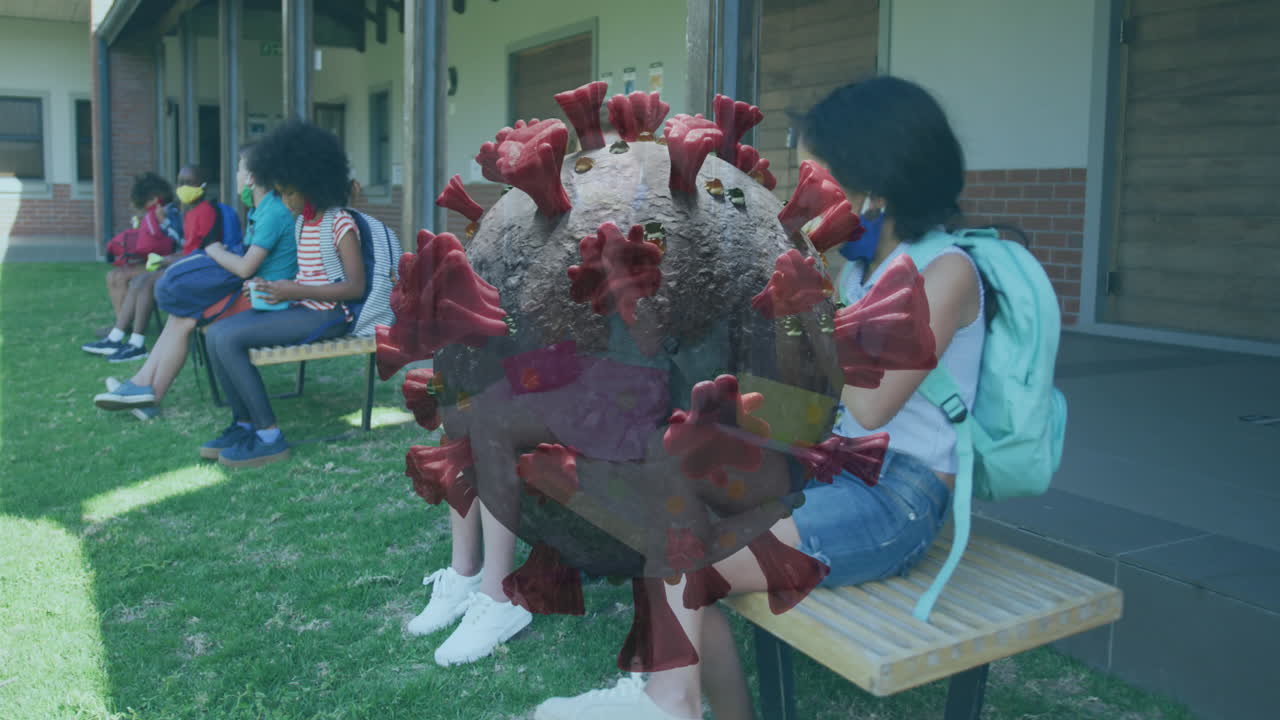 코로나 19 세포의 애니메이션 학교 아이들이 사회적 거리를 지키고 마스크를 쓰고 먹고 있습니다.