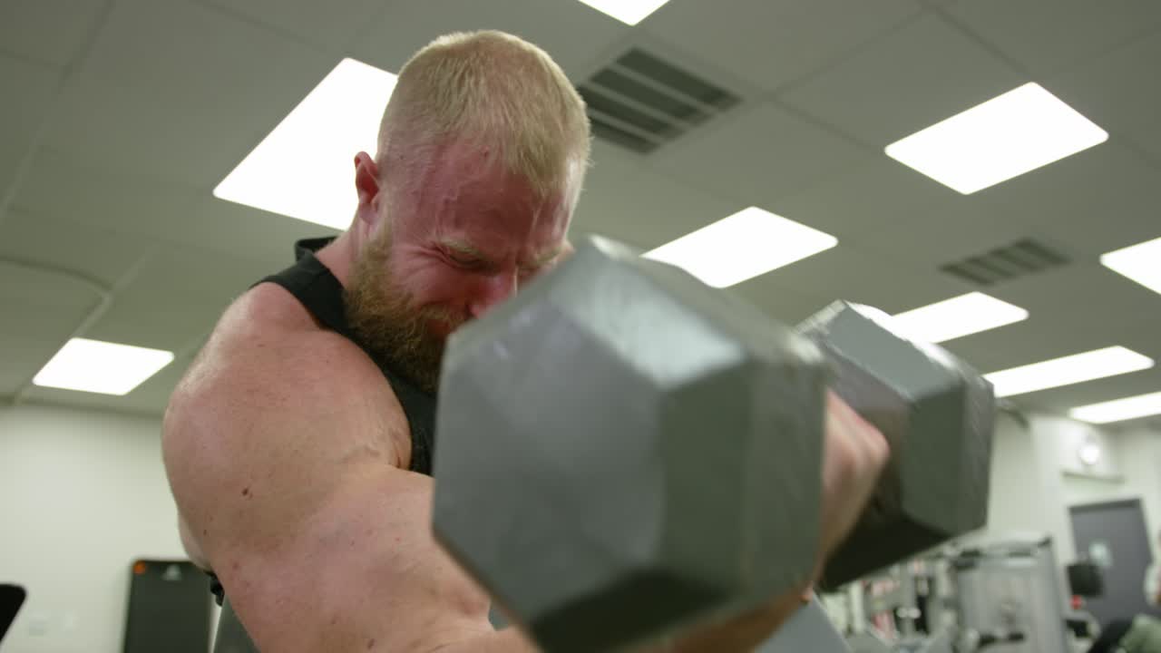 Muscular bodybuilder handsome men doing exercises in gym