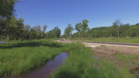 walking path winds through wetlands in the park