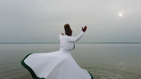 sunset and whirling at the sea, sufi. sufi whirling (turkish: semazen)