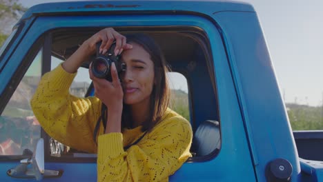 young woman on a road trip in pick-up truck