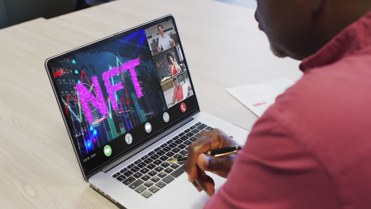African american businessman using laptop for video call with diverse business colleagues