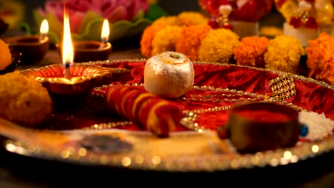 diwali puja - shot of a woman preparing puja thali / plate