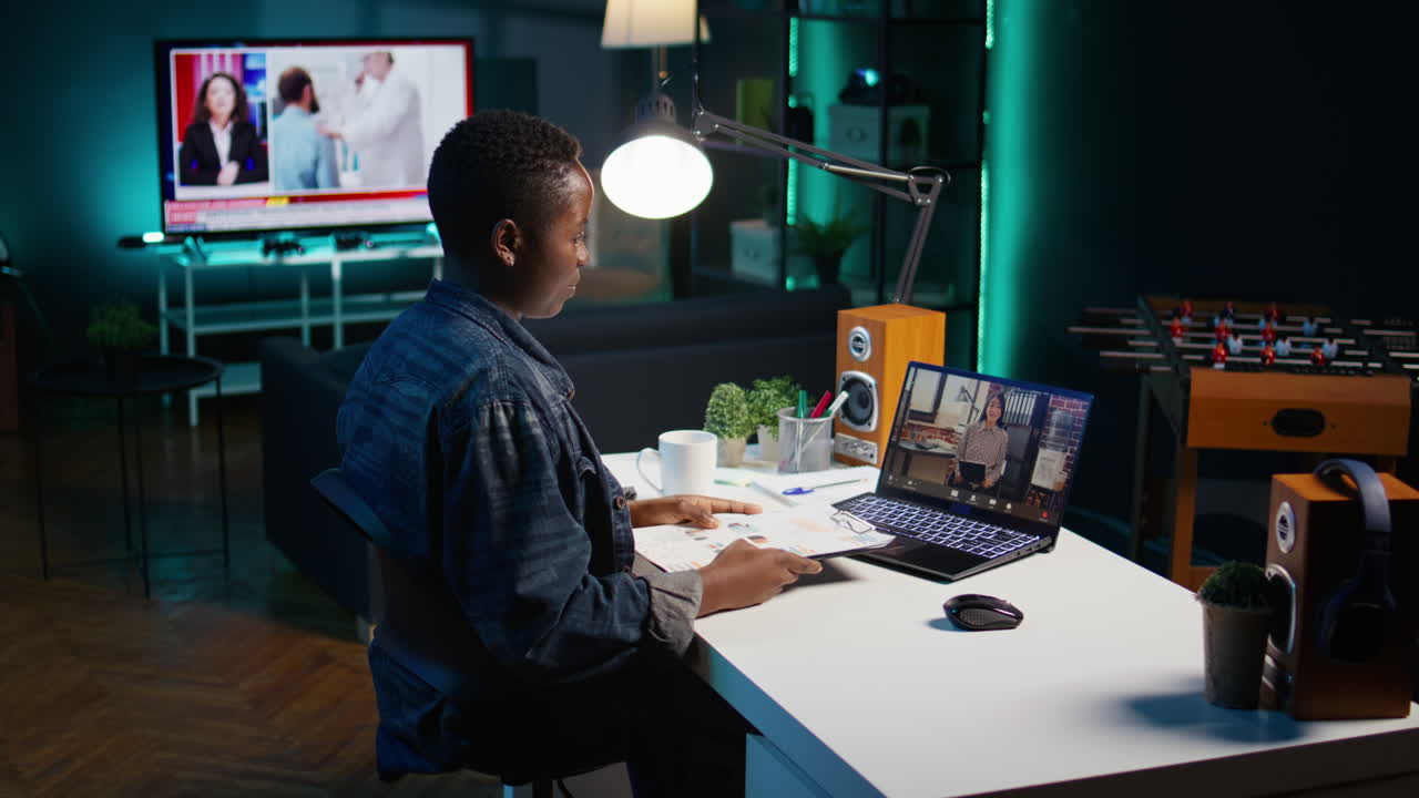 Woman studying online at home at night
