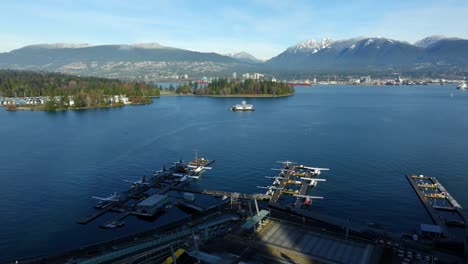 panorama of seaplanes docked at vancouver harbour flight centre at coal harbour in vancouver, british columbia, canada