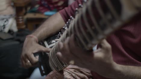 an indian man's playing sitar