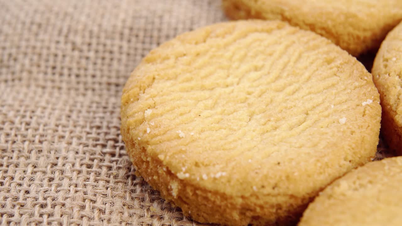 Shortbread biscuits on a rustic rough burlap. Macro