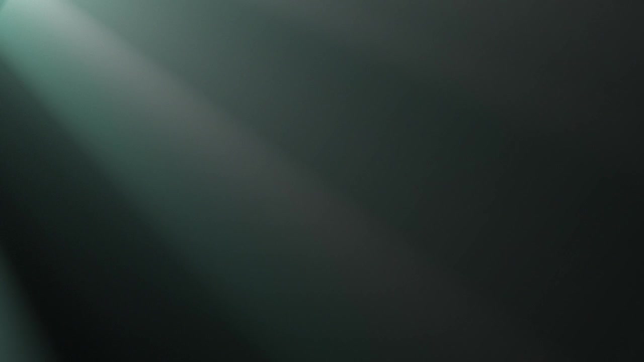 Ethereal Light Rays Moving Through Smoke on Dark Background