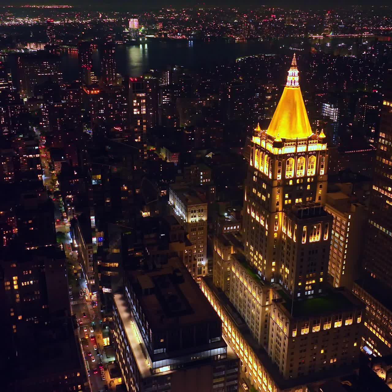 Endless cityscape of New York with billions of lights. Sparkling vibrant metropolis at night. Aerial view