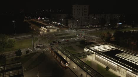wide drone shot of busy traffic in warsava during the evening