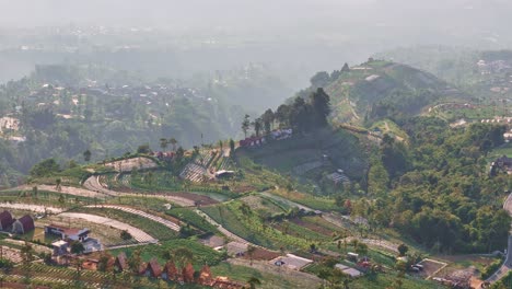 hilly terrain and villages of indonesia, aerial view