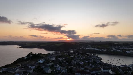 forward shot of polruan, cornwall, english town on a gentle, cloudy sunset.