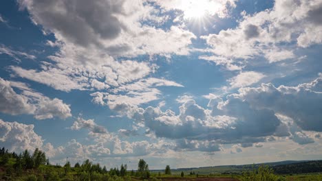 white clouds, clear soft sky, time lapse formating cloudscape in horizon, rainy rolling fast moving, beautiful summer sunny day, colourful weather.