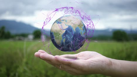 young woman's hands holding spinning globe at outside. ultra hd video ( 4k ). elements of this image furnished by nasa