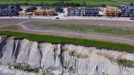 housing development land with new homes under construction near lake and beaches