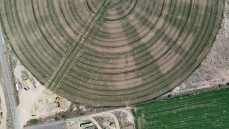 circular pivot or king spin irrigation system near green river, utah, usa - aerial top down