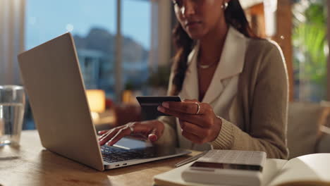 woman using laptop and credit card for online shopping
