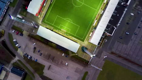 top down aerial of soccer players playing football in stadium