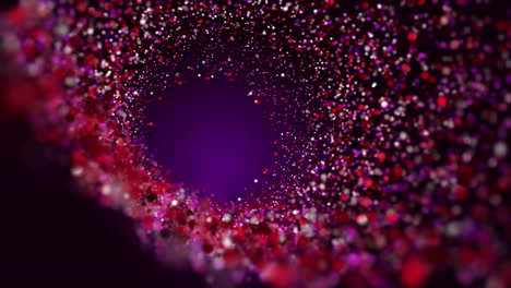 red glowing particles orbiting glowing plasma. animation of nuclear fusion process on purple background. loop motion graphic.