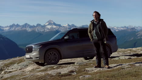 man and suv in a mountainous landscape