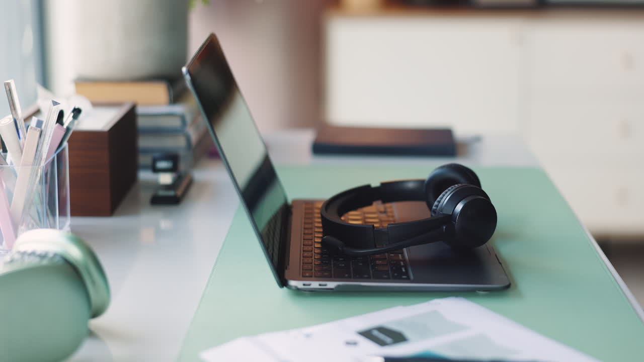 Laptop and headphones on a desk