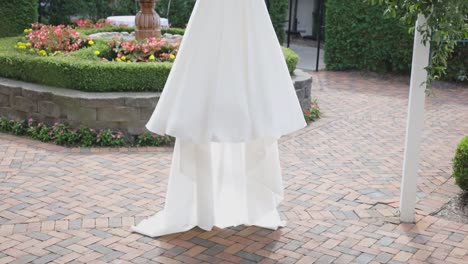 Wedding-dress-slowly-revealed-while-hanging