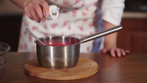 making raspberry jam with whipped cream