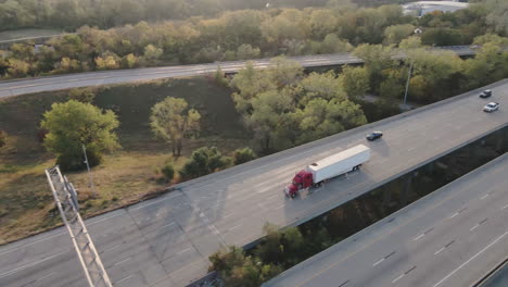 aerial view of highway intersection with trucks and cars