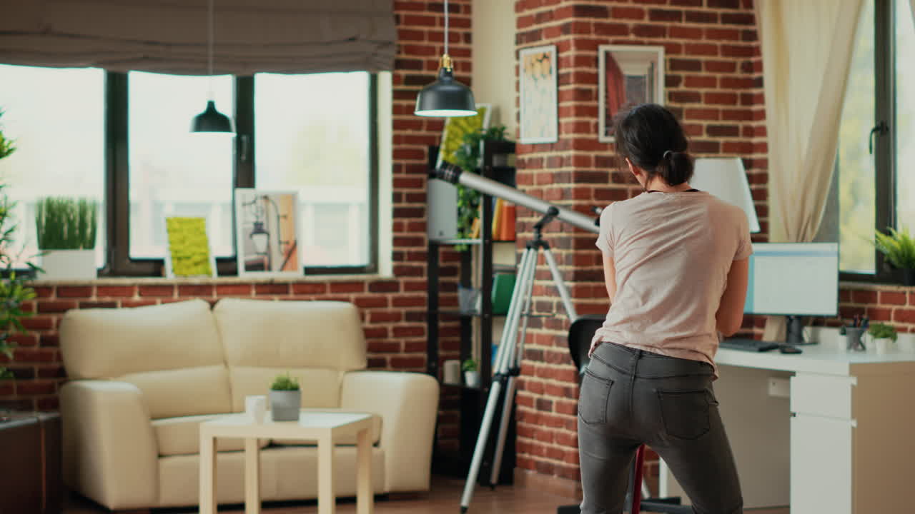 Female person singing and dancing in apartment