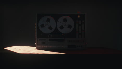 a vintage tape recorder in a red blinking light