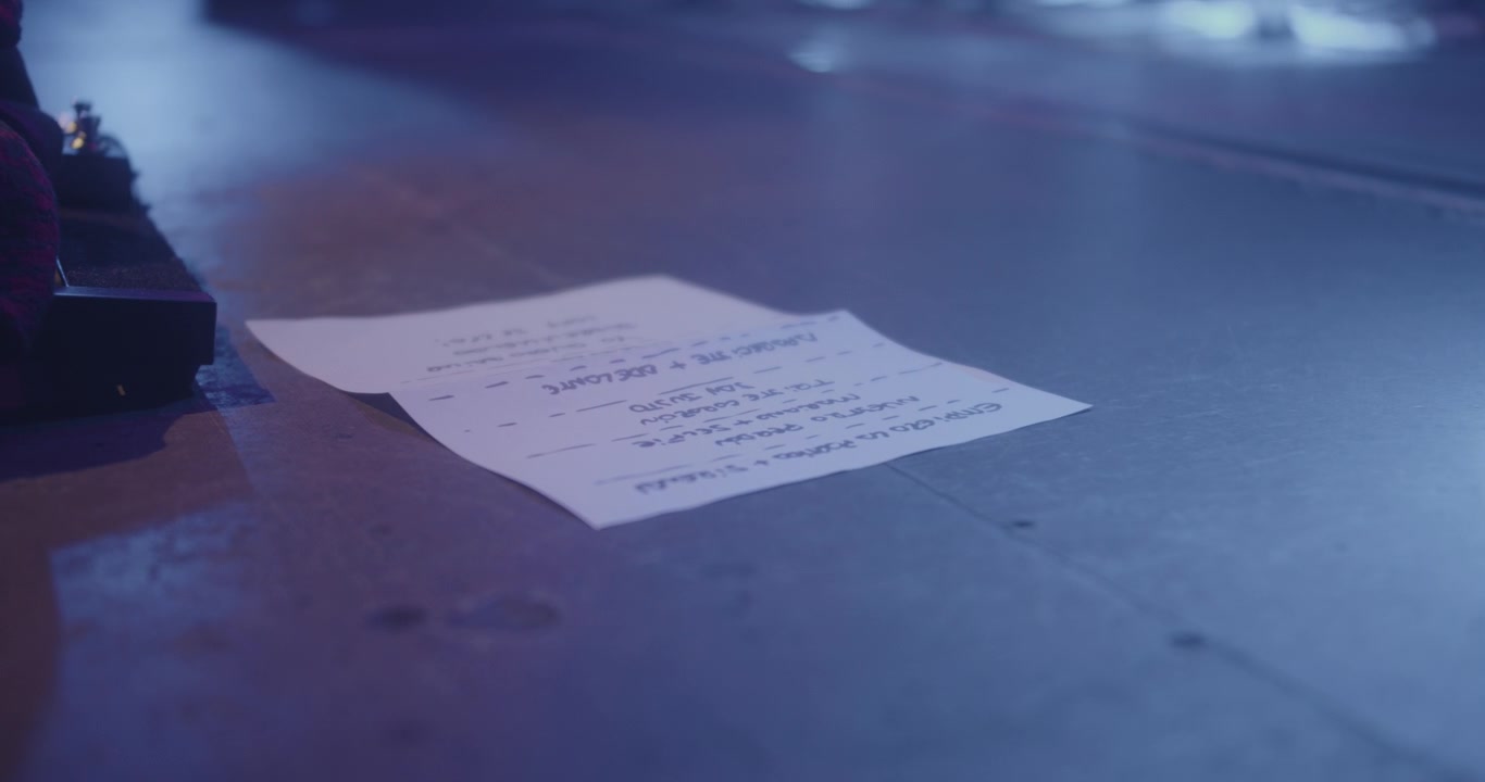 Amazing detail shot of a paper with the setlist of the band's songs that they are going to play during their concert