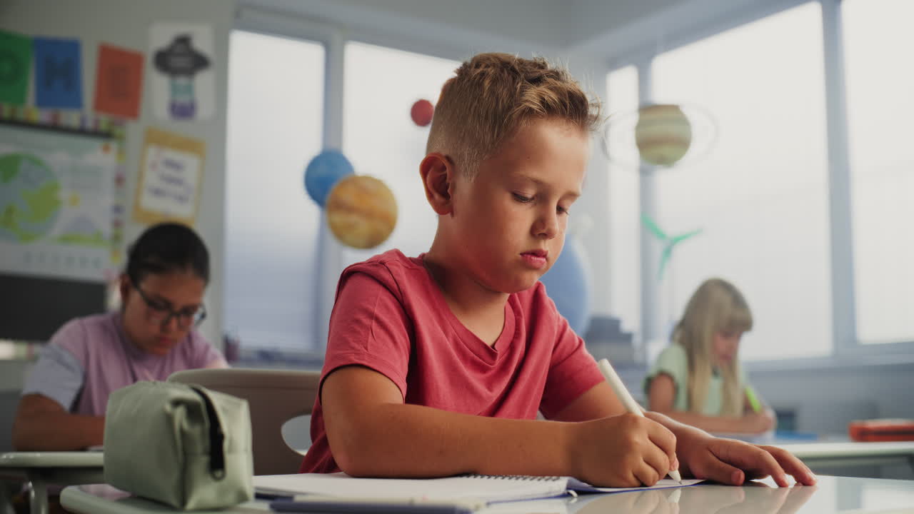 Students in a classroom writing