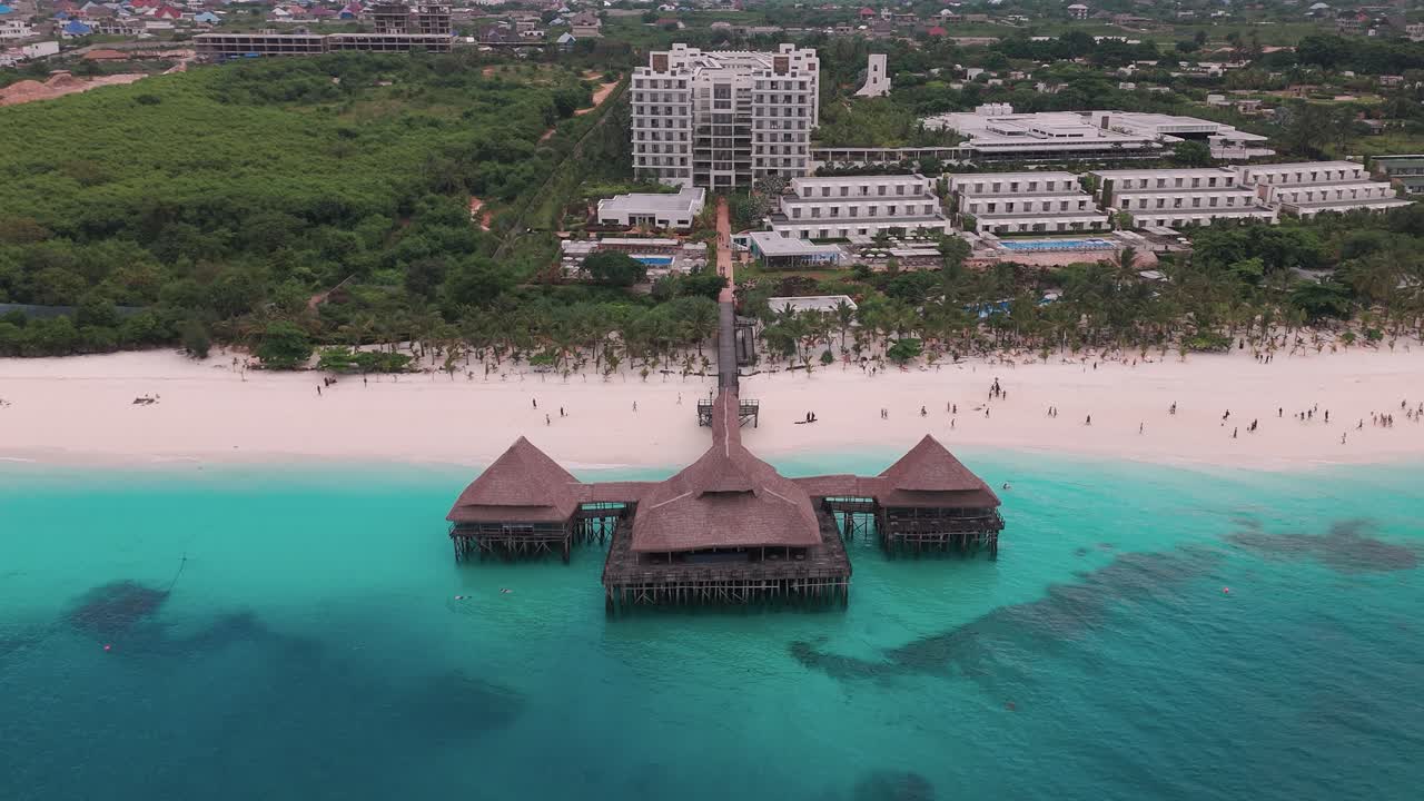 The hotel riu jambo in zanzibar, showcasing the beach, ocean, and resort , aerial view