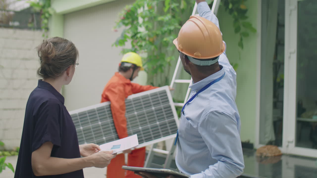 Engineer Telling Woman about Solar Panels Installation