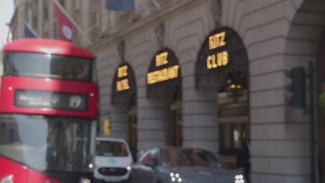 Defocused-Shot-Of-The-Ritz-Hotel-On-Piccadilly-In-London-UK-With-Traffic-In-Foreground