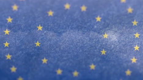 animation of flag of european union with spinning stars over sky with clouds