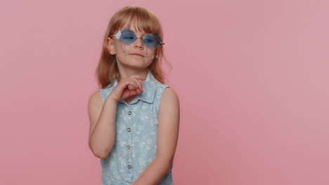 child girl kid wearing pink sunglasses, charming smile, showing thumbs up like, positive feedback