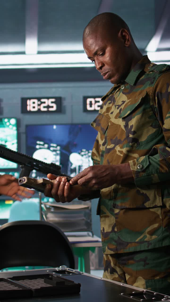 Vertical video Soldiers doing checkup on rifles and pistols in command post